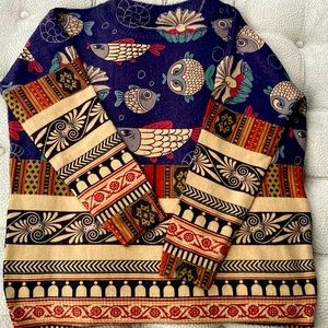 One size fits all. Great with Leggings.  NEVER WORN!!